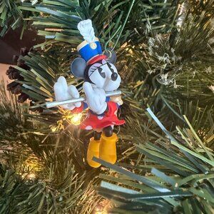 This Hallmark Keepsake Ornament titled “Minnie Plays the Flute”